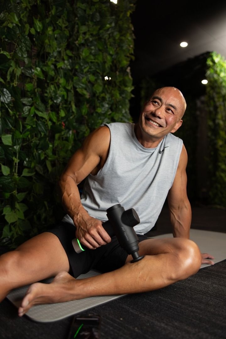 Man using massage gun